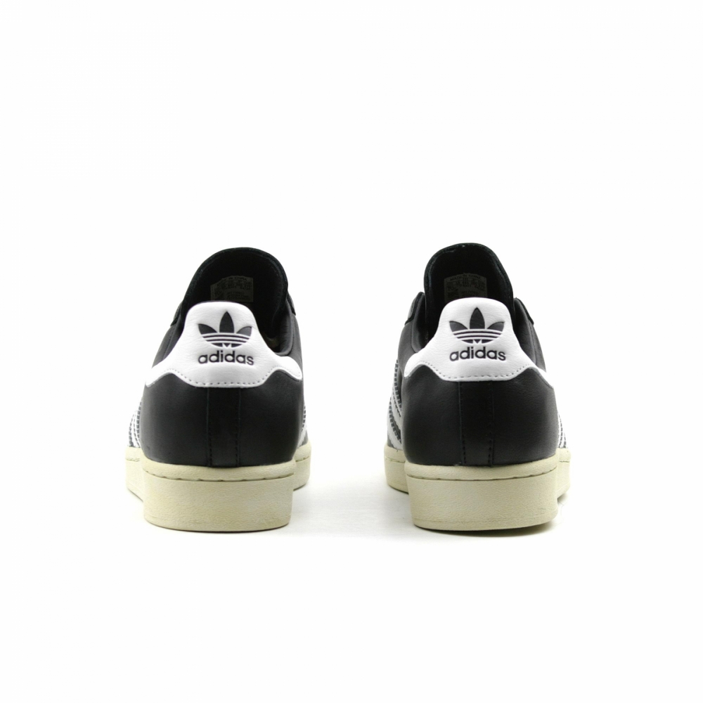 Superstar black deals with blue stripes