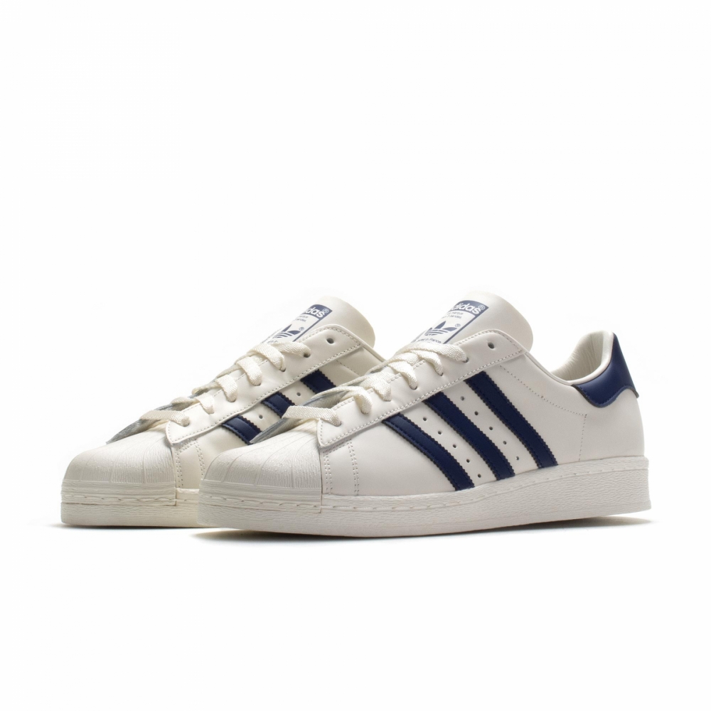 White and navy deals shell toe adidas